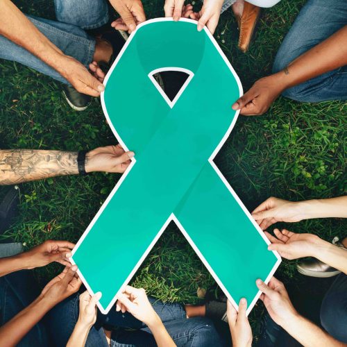 group-people-holding-green-colored-ribbon